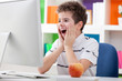 Foto: Surprised boy with computer Surprised boy with computer