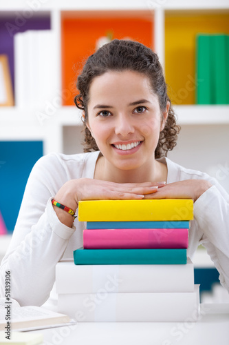 Photo: cheerful schoolgirl with books cheerful schoolgirl with books
