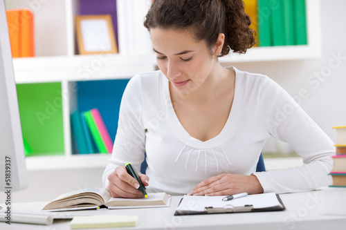 Photo: teenager student doing homework teenager student doing homework