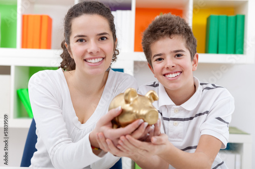 Photo: Children with piggybank Children with piggybank