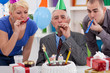 Photo: Happiness senior man on his birthday Happiness senior man on his birthday