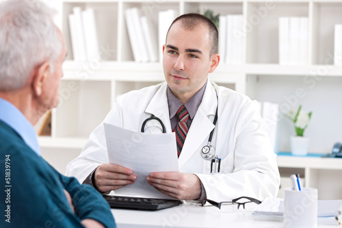 Photo: doctor talking with senior patient doctor talking with senior patient