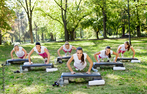 Photo: group of a women doing exercises group of a women doing exercises
