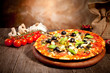 Delicious fresh pizza served on wooden table