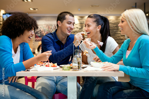 Photo: Group of teenagers enjoying in lunch Group of teenagers enjoying in lunch