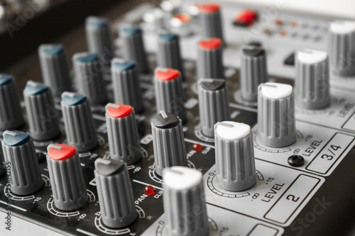 Photo: Detail of a music mixer in studio Detail of a music mixer in studio