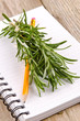 Foto: rosemary on a kitchen notebook rosemary on a kitchen notebook