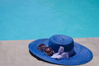 Women's stuff by swimming pool