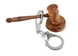 Gavel and handcuffs isolated on white