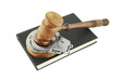 Judge's gavel and handcuffs on black legal book isolated