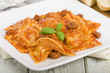 Ravioli filled with chicken & chorizo. Tomato & chorizo sauce.