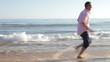 Video: Senior Couple Running Along Beach Holding Hands Senior Couple Running Along Beach Holding Hands