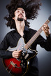 Man playing guitar during concert