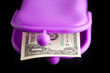 purple wallet with money on black