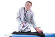 Businessman ironing his pants