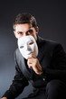 Man with mask in the dark