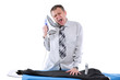 Businessman ironing his pants