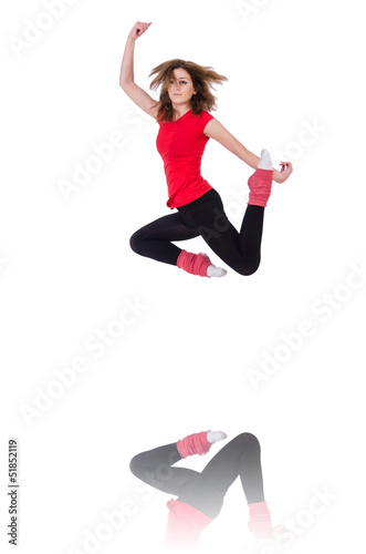 Photo: Young gymnast exercising on white Young gymnast exercising on white