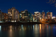 Luxury condos at night along the Bow River in Calgary Alberta