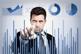 Businessman examining charts