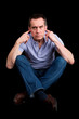 Angry Man Fingers in Ears Not Listening Cross Legged