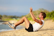 Sit ups - fitness crossfit man doing situps