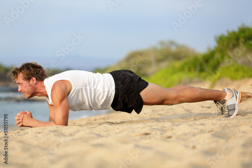 Photo: Crossfit training fitness man plank exercise Crossfit training fitness man plank exercise