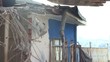 Building demolition, excavator and twisted rebars