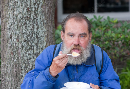 Photo: Homeless man eating Homeless man eating