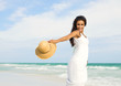 Happy young  woman at the beach
