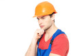 Photo: portrait of thinking handyman in uniform portrait of thinking handyman in uniform