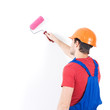 Photo: Craftsman painter stands on the stairs with roller Craftsman painter stands on the stairs with roller
