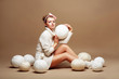 Knitting. Sewing. Woman in White Clothing with Clews of Yarn
