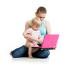 mother and child working at laptop