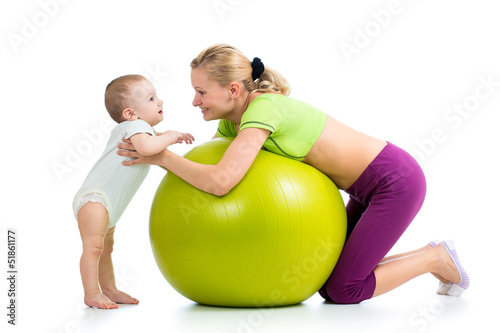 Photo: mother with baby having fun with gymnastic ball mother with baby having fun with gymnastic ball