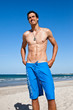 Handsome fit young man on the beach