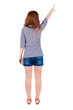Back view of  pointing woman