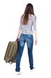 back view of walking  woman  with suitcase.