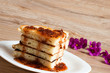 A stack of pancakes with jam gooseberry