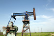 oil worker and pump jack industry scene