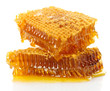 sweet honeycombs with honey, isolated on white