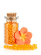 Little bottle full with colorful beads isolated on white