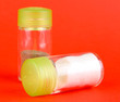 Salt and pepper shakers on color background