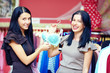 beautiful elegant women in clothes lingerie store