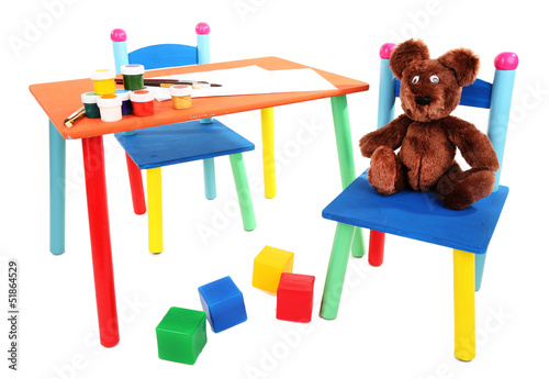 Photo: Small and colorful table and chairs for little kids isolated Small and colorful table and chairs for little kids isolated
