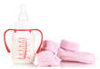 Bottle for milk formula with booties isolated on white