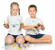 Photo: girl and boy are painting girl and boy are painting