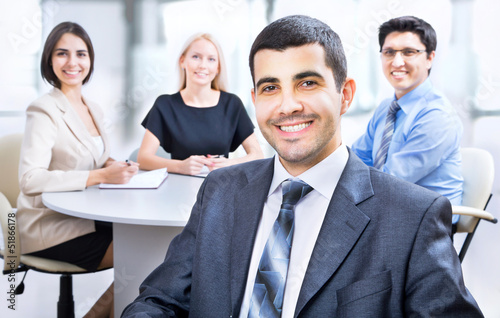 Photo: Business man with colleagues Business man with colleagues