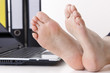 Bare feet on the desk