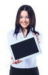 Isolated young business woman showing digital tablet